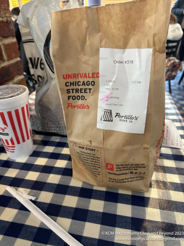 a paper bag with a receipt on it