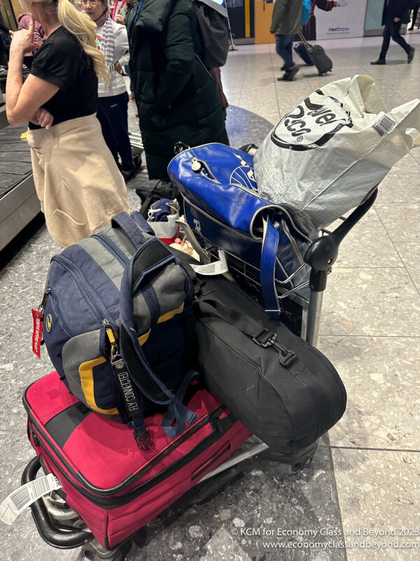 luggage on a cart with bags