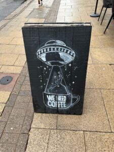 a sign on the sidewalk