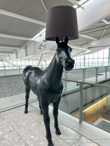 a statue of a horse with a lamp shade