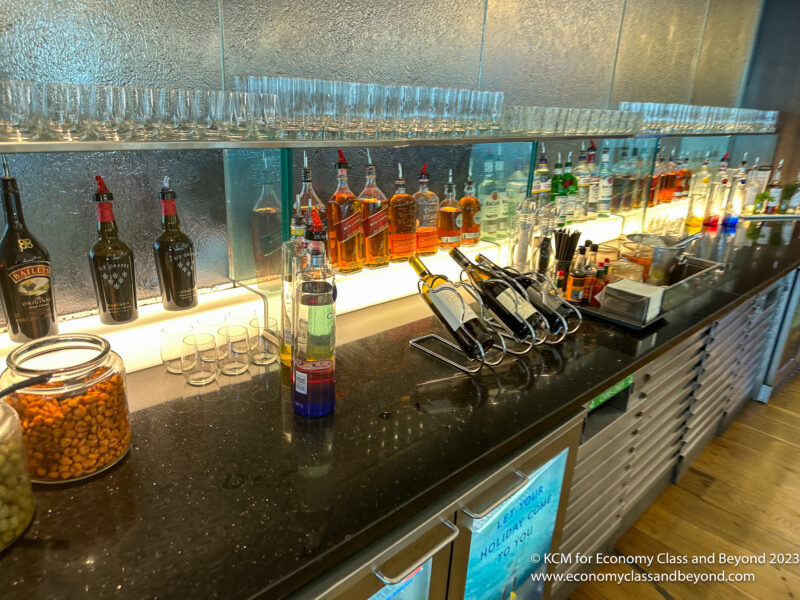 a bar with bottles of liquor and glasses