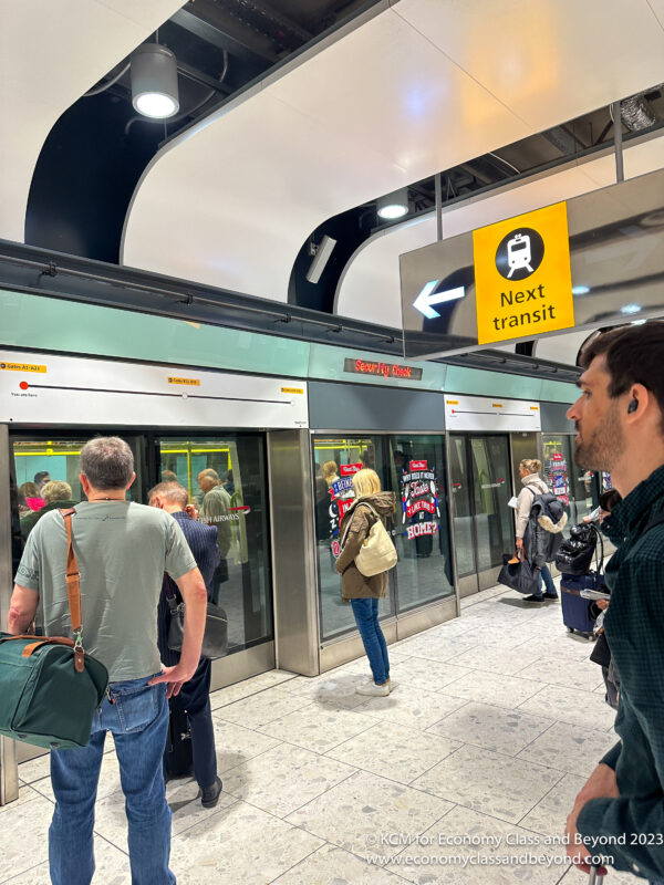 people standing in front of a subway