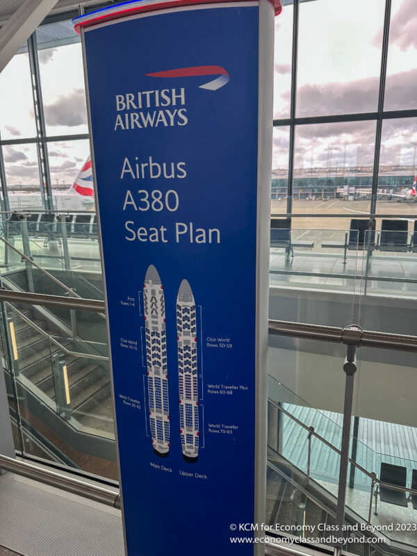 a blue sign with a diagram of a plane