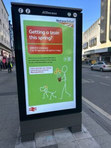 a sign on a sidewalk