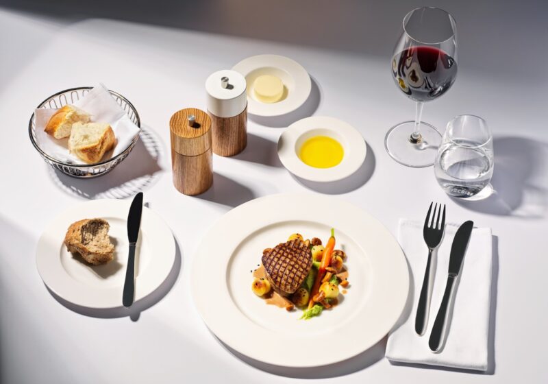 a plate of food and wine glasses