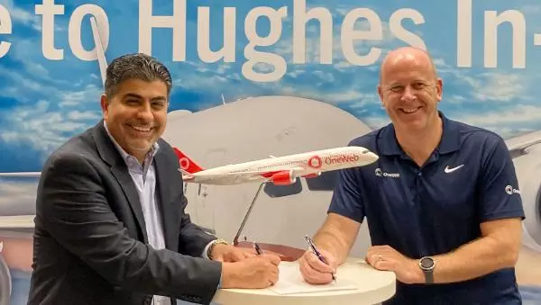 two men signing a plane
