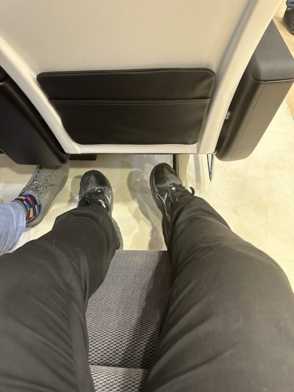 a person's legs and feet in black pants
