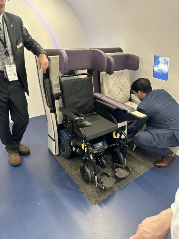 a man looking at a wheelchair