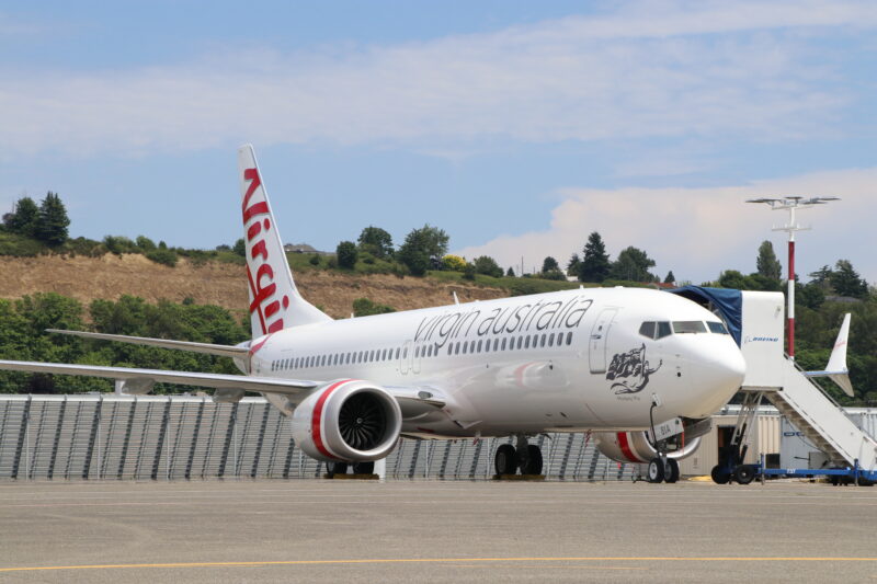 a white airplane on a runway