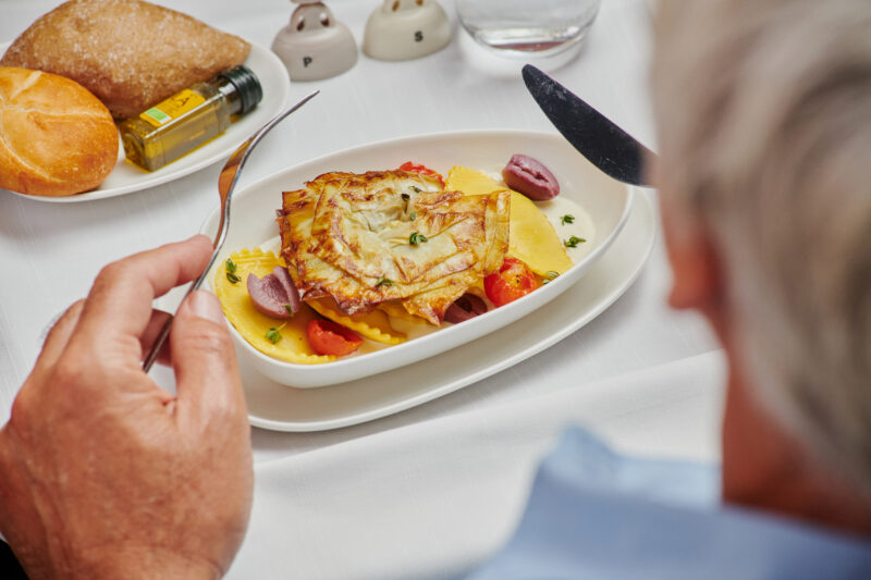 a person eating food on a plate