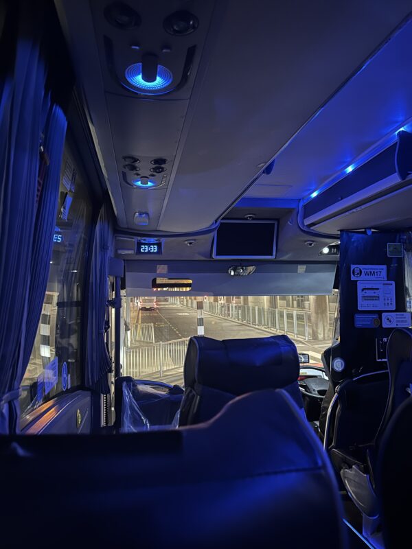 inside a bus with blue lights