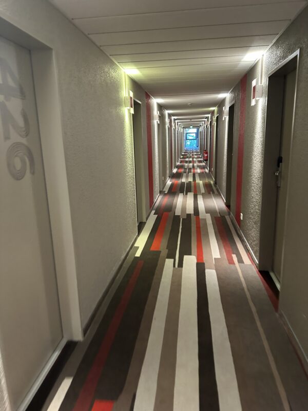 a hallway with colorful carpet