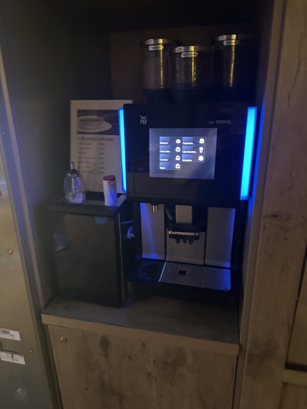 a machine with a screen and a blue light