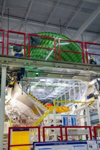 a large green object in a factory