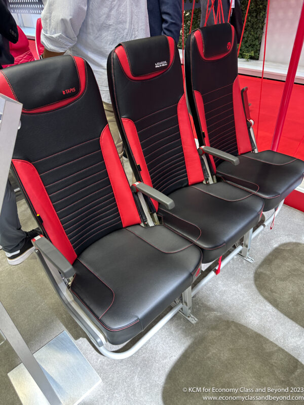 a row of black and red seats