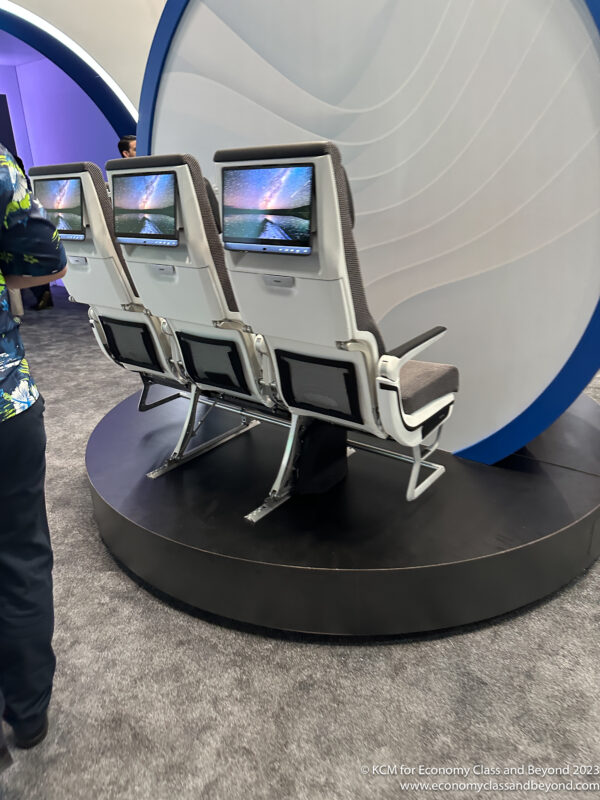 a group of seats with screens on them