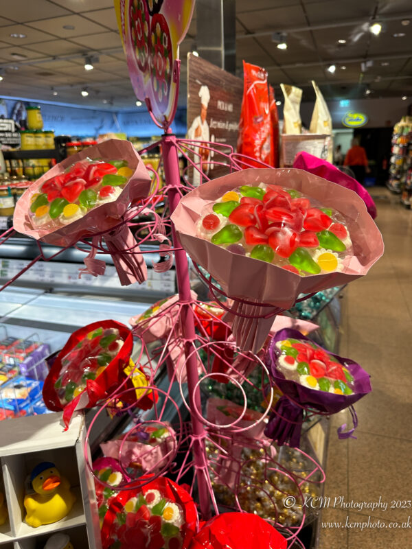 a pink display with candy in it