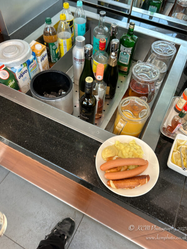a counter with a plate of food and drinks