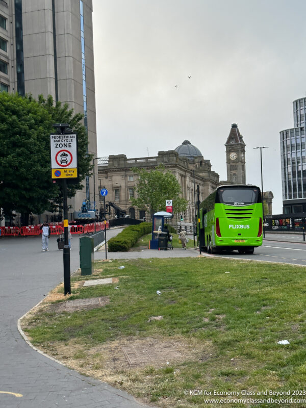 a green bus on the street