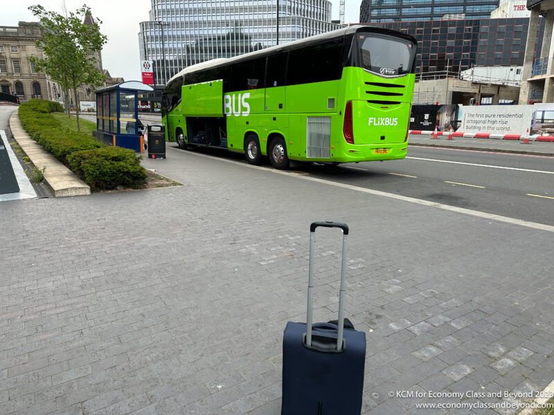 a green bus on the street