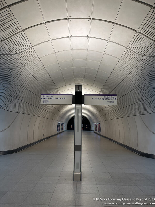 a white tunnel with signs