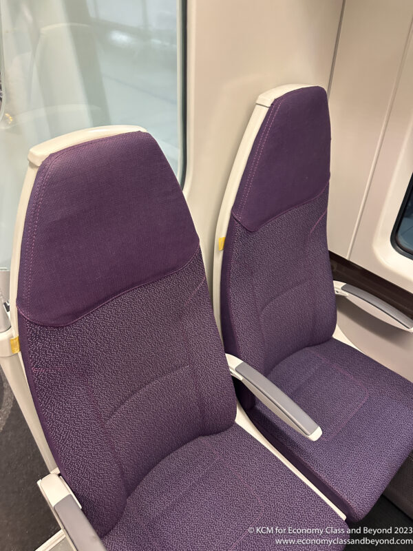 a purple seats on a train