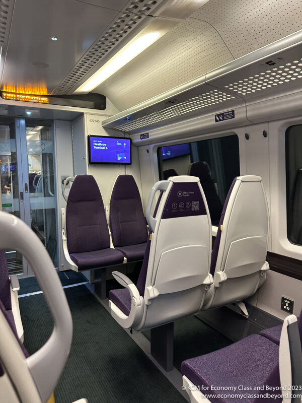 a train with seats and a screen