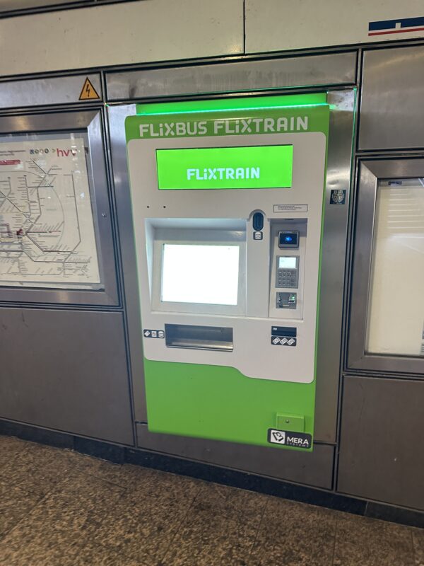 a green and white machine with a white screen