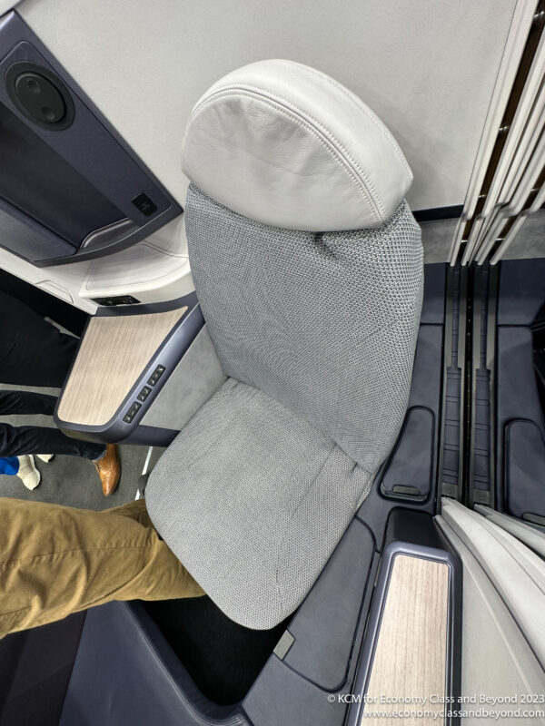 a grey chair in a plane
