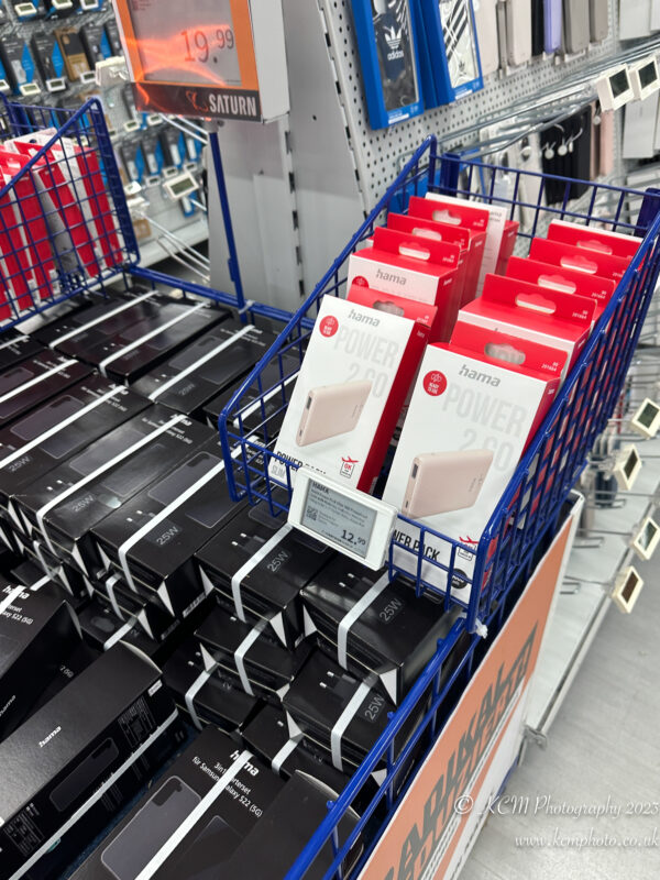 a blue cart with boxes of cell phones