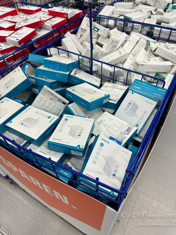 a blue and white cart full of boxes