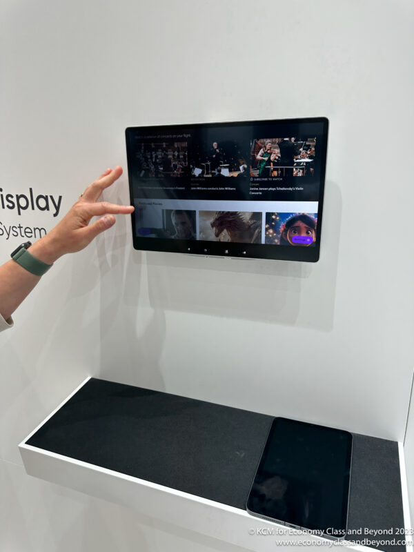 a hand reaching out to display a screen