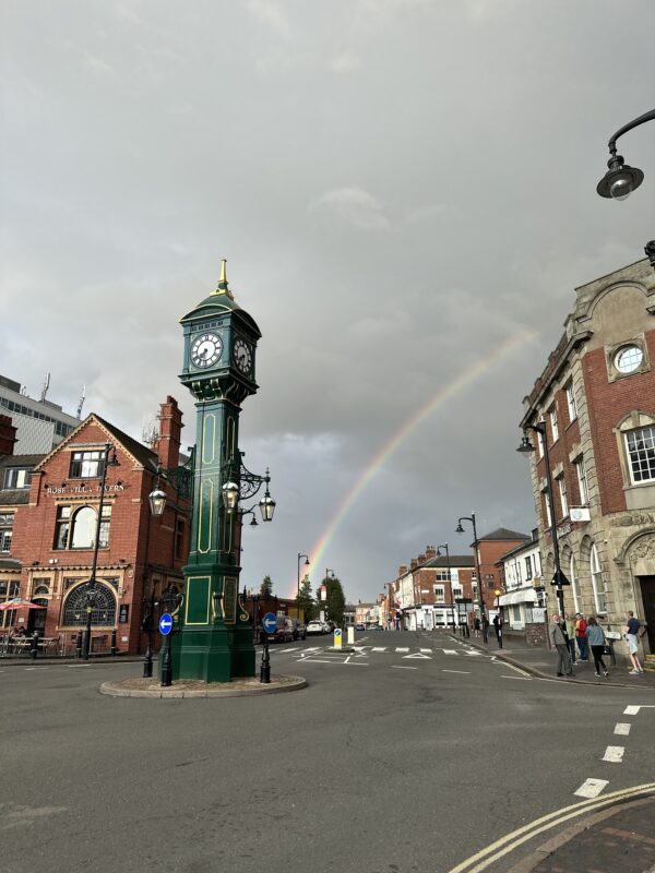 a rainbow over a street