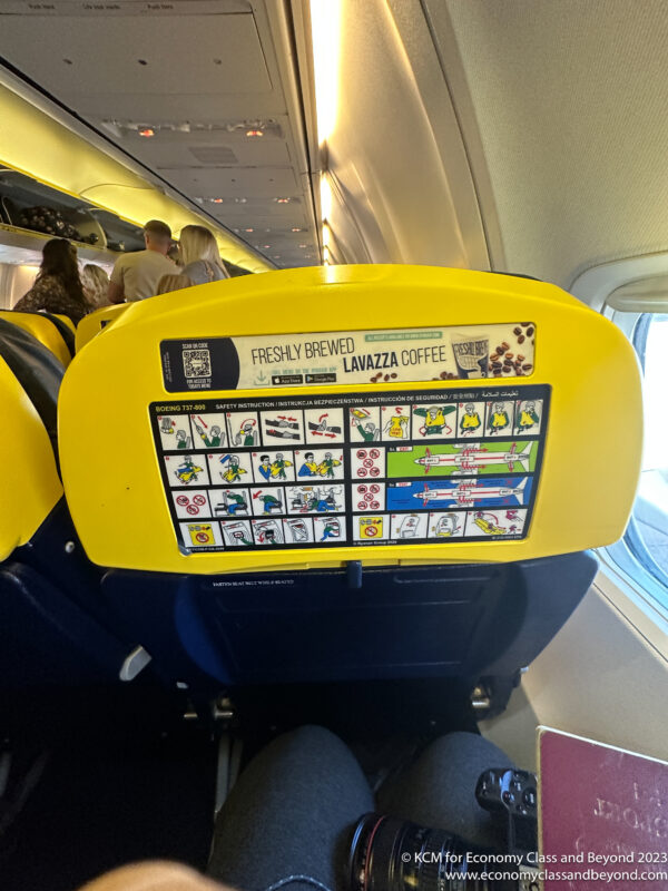 a yellow and blue seat on an airplane