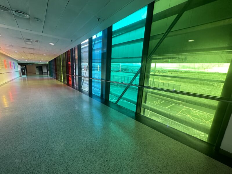 a hallway with colorful glass panels