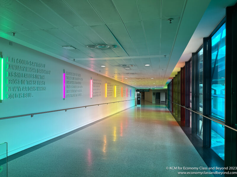 a long hallway with colorful lights