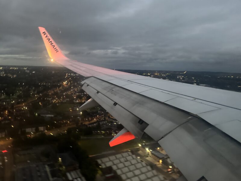 an airplane wing with lights on the wing