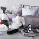a group of cosmetic products and a silver bag