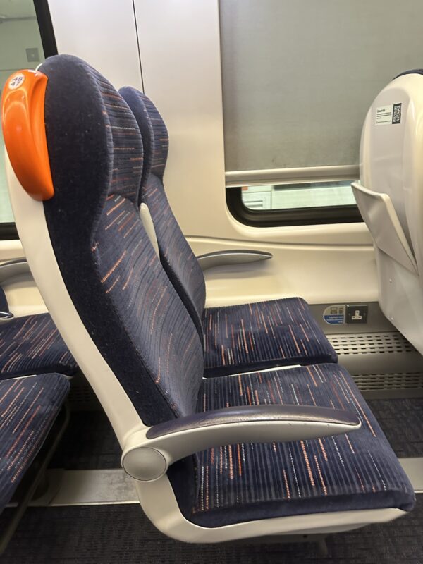 seats in a train with a window