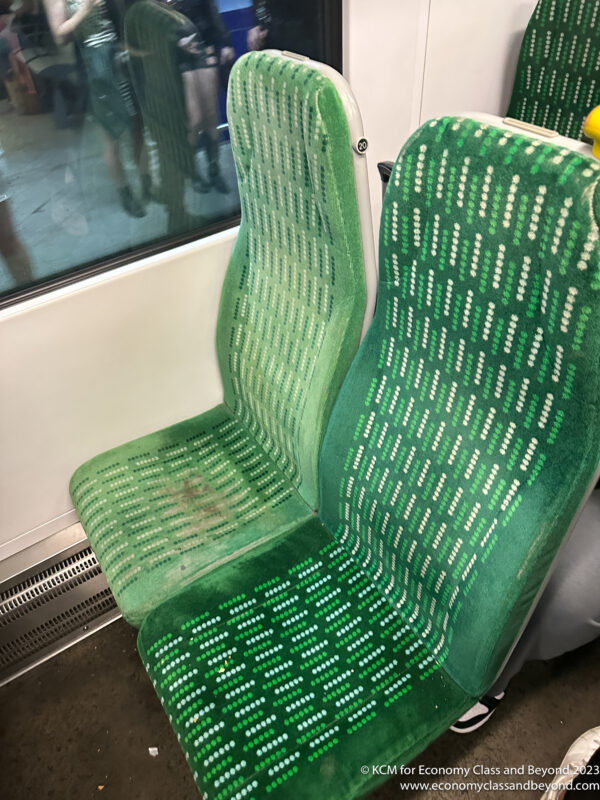a green seats on a bus