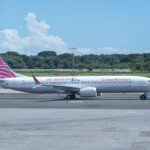 a white airplane on a runway