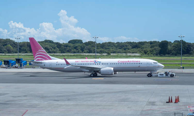 a white airplane on a runway