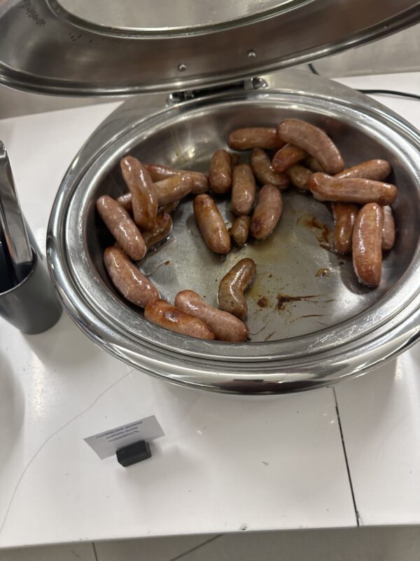 a bowl of sausages on a table
