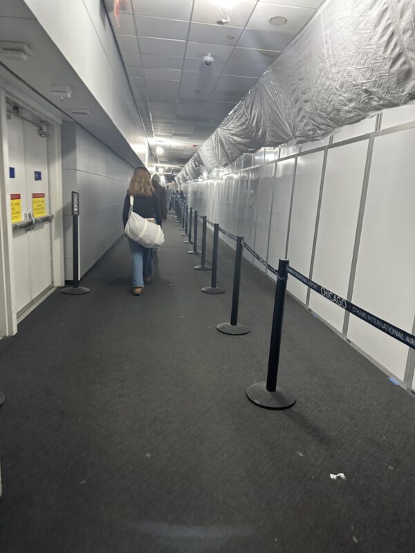 a woman walking in a hallway