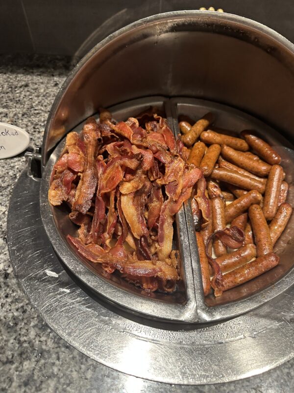 a bowl of bacon and sausages