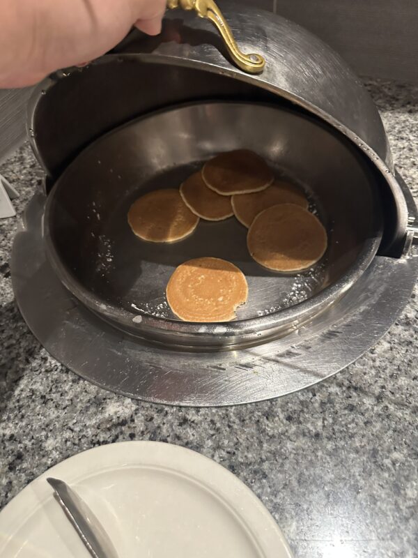 a pancake cooking in a pan