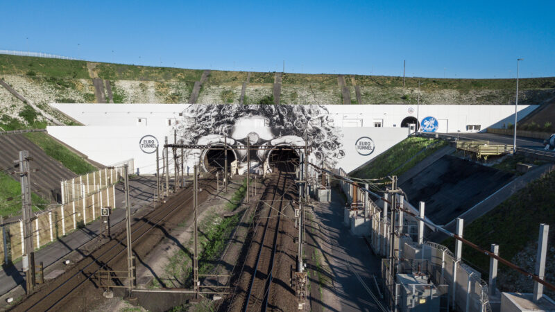 a train tracks going through a tunnel