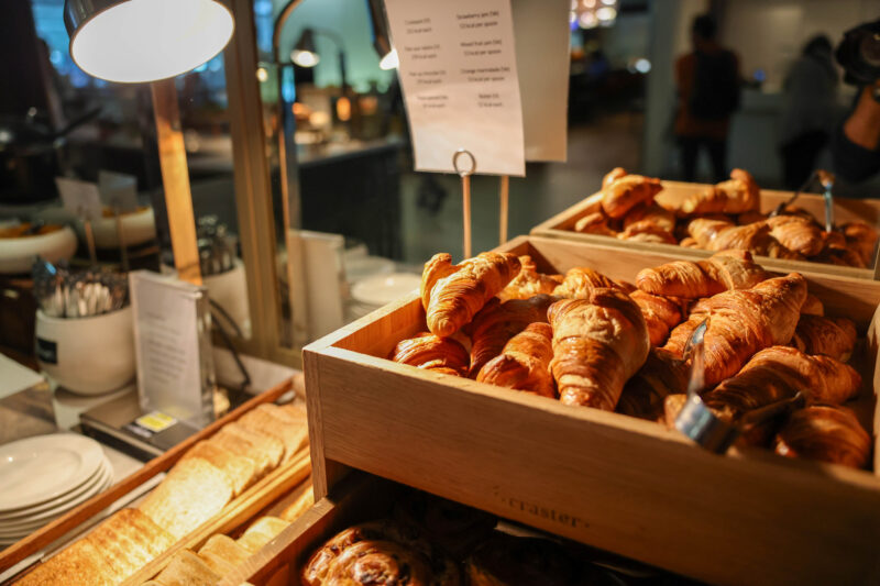 a wooden trays of croissants