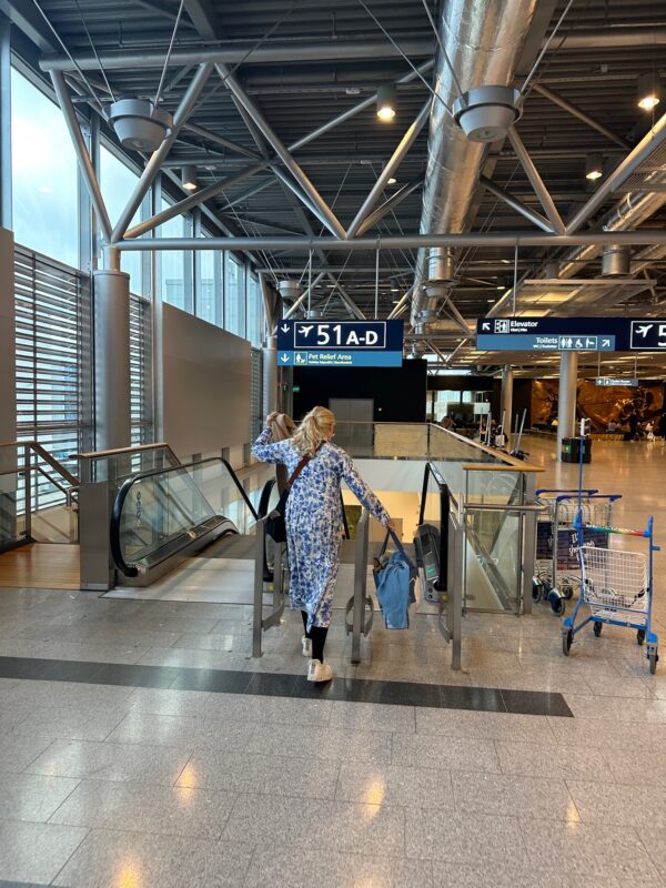 a woman walking in an airport
