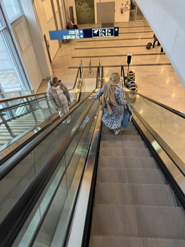 a woman on an escalator